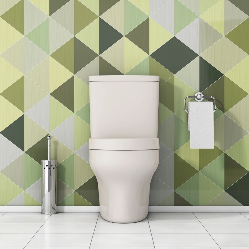 : A white toilet in a bathroom